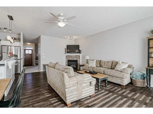 103 Bridle Estates Mews Sw, Calgary, AB - Indoor Photo Showing Living Room With Fireplace