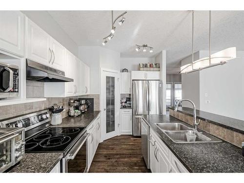 103 Bridle Estates Mews Sw, Calgary, AB - Indoor Photo Showing Kitchen With Stainless Steel Kitchen With Double Sink With Upgraded Kitchen