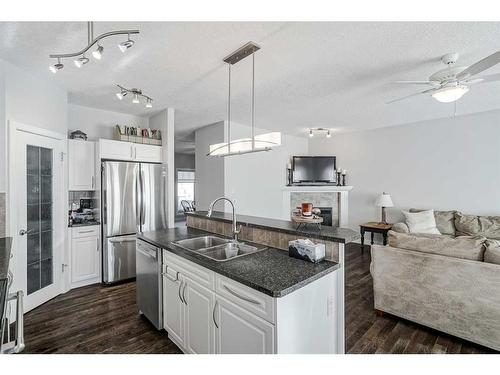 103 Bridle Estates Mews Sw, Calgary, AB - Indoor Photo Showing Kitchen With Stainless Steel Kitchen With Double Sink With Upgraded Kitchen