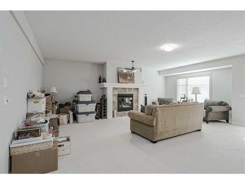 103 Bridle Estates Mews Sw, Calgary, AB - Indoor Photo Showing Living Room With Fireplace