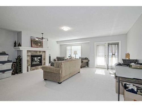 103 Bridle Estates Mews Sw, Calgary, AB - Indoor Photo Showing Living Room With Fireplace