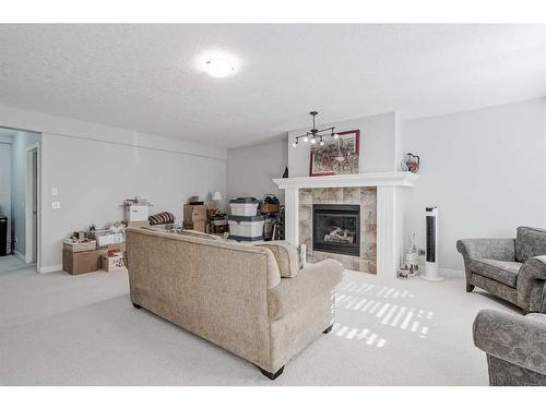 103 Bridle Estates Mews Sw, Calgary, AB - Indoor Photo Showing Living Room With Fireplace