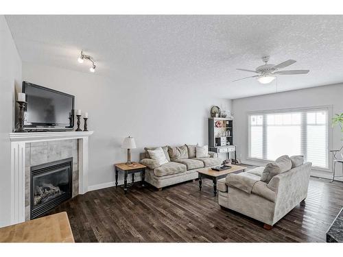 103 Bridle Estates Mews Sw, Calgary, AB - Indoor Photo Showing Living Room With Fireplace