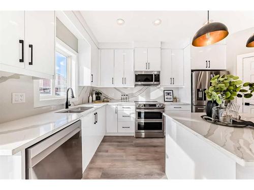 29 Silverado Skies Drive Sw, Calgary, AB - Indoor Photo Showing Kitchen With Stainless Steel Kitchen With Double Sink With Upgraded Kitchen