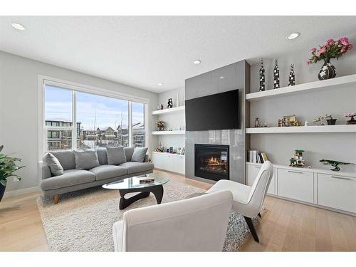 22 West Grove Way Sw, Calgary, AB - Indoor Photo Showing Living Room With Fireplace