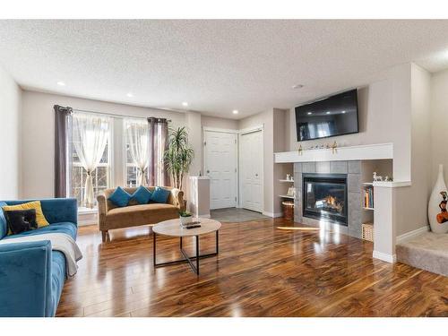 214 Cranford Park Se, Calgary, AB - Indoor Photo Showing Living Room With Fireplace