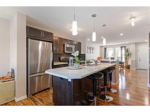 214 Cranford Park Se, Calgary, AB - Indoor Photo Showing Kitchen With Double Sink With Upgraded Kitchen