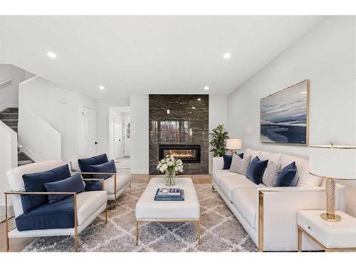 16 Erin Circle Se, Calgary, AB - Indoor Photo Showing Living Room With Fireplace