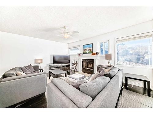 2310 14A Street Sw, Calgary, AB - Indoor Photo Showing Living Room With Fireplace