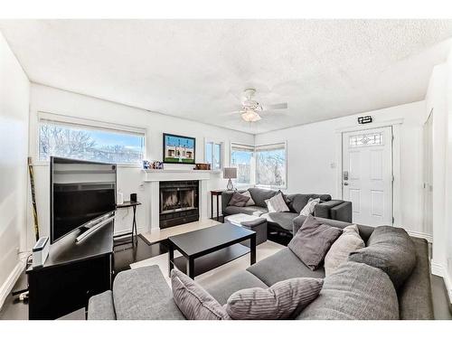 2310 14A Street Sw, Calgary, AB - Indoor Photo Showing Living Room With Fireplace