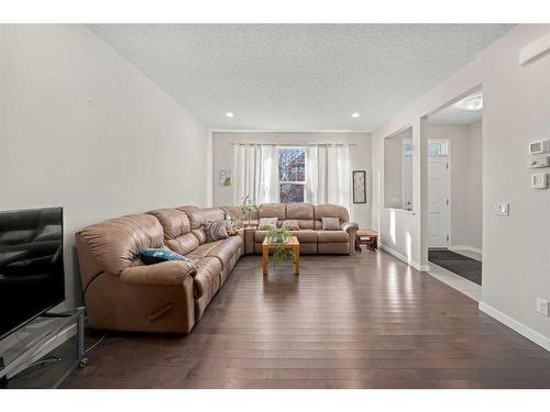 116 New Brighton Grove Se, Calgary, AB - Indoor Photo Showing Living Room