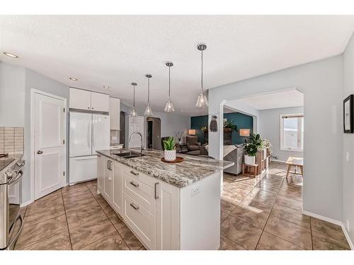 95 Tuscany Hills Park Nw, Calgary, AB - Indoor Photo Showing Kitchen With Double Sink With Upgraded Kitchen