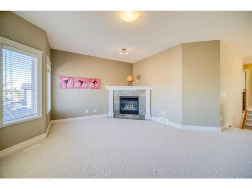 39 Weston Rise Sw, Calgary, AB - Indoor Photo Showing Living Room With Fireplace