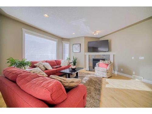 39 Weston Rise Sw, Calgary, AB - Indoor Photo Showing Living Room With Fireplace