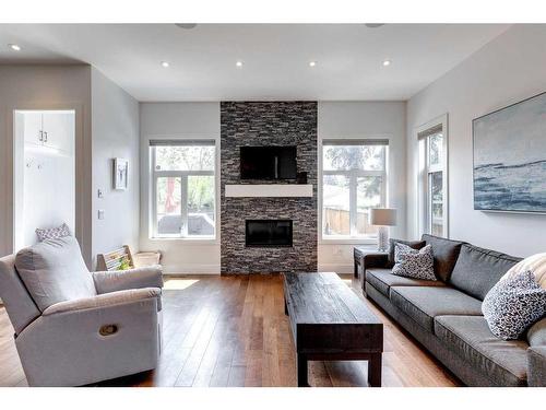 2033 45 Avenue Sw, Calgary, AB - Indoor Photo Showing Living Room With Fireplace