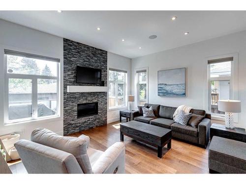 2033 45 Avenue Sw, Calgary, AB - Indoor Photo Showing Living Room With Fireplace