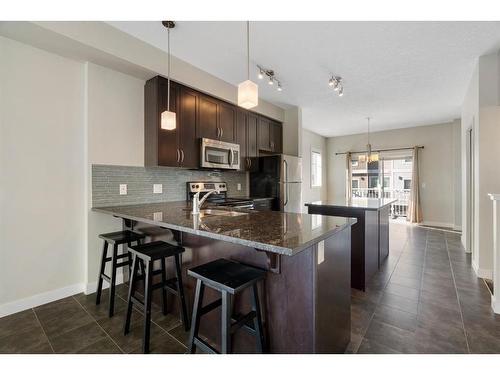 16 Redstone Circle Ne, Calgary, AB - Indoor Photo Showing Kitchen With Stainless Steel Kitchen With Double Sink With Upgraded Kitchen