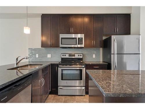 16 Redstone Circle Ne, Calgary, AB - Indoor Photo Showing Kitchen With Stainless Steel Kitchen With Double Sink With Upgraded Kitchen