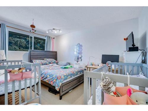 1031 Cannock Place Sw, Calgary, AB - Indoor Photo Showing Bedroom