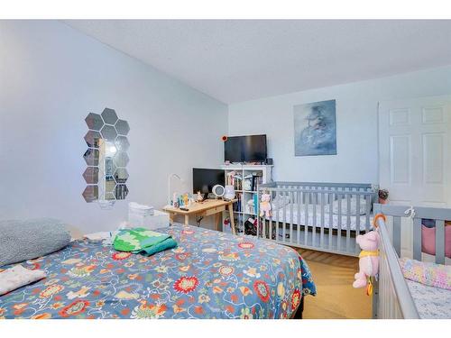 1031 Cannock Place Sw, Calgary, AB - Indoor Photo Showing Bedroom