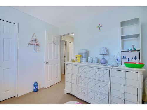 1031 Cannock Place Sw, Calgary, AB - Indoor Photo Showing Bedroom