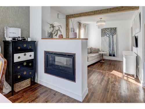 2418 Westmount Road Nw, Calgary, AB - Indoor Photo Showing Living Room With Fireplace