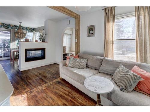 2418 Westmount Road Nw, Calgary, AB - Indoor Photo Showing Living Room With Fireplace