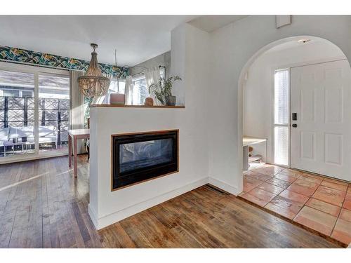 2418 Westmount Road Nw, Calgary, AB - Indoor Photo Showing Living Room With Fireplace