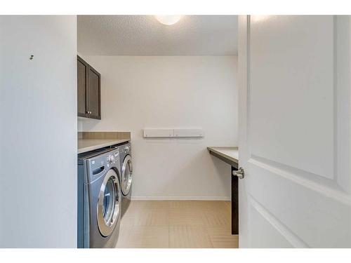 44 West Coach Road Sw, Calgary, AB - Indoor Photo Showing Laundry Room