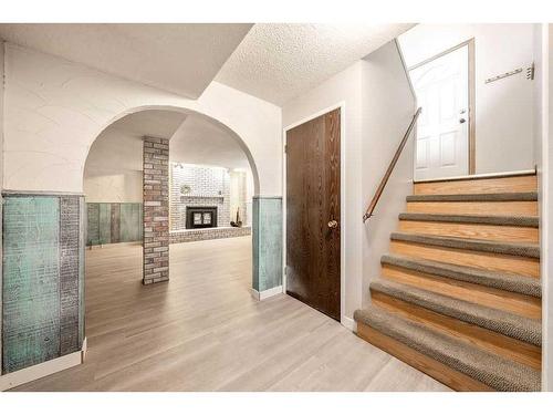 619 Templeside Road Ne, Calgary, AB - Indoor Photo Showing Other Room With Fireplace