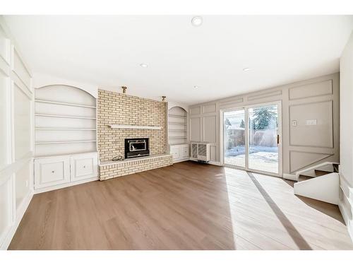 2 Grove Hill Place Sw, Calgary, AB - Indoor Photo Showing Living Room With Fireplace