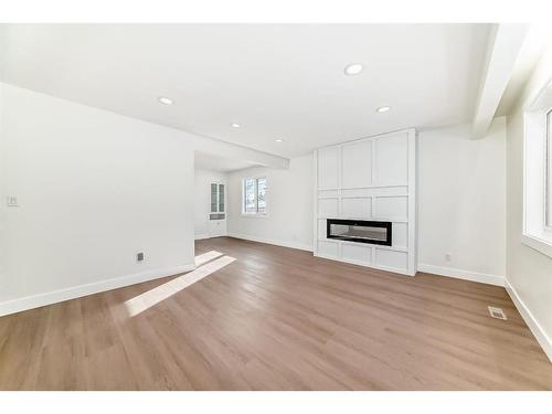 2 Grove Hill Place Sw, Calgary, AB - Indoor Photo Showing Other Room With Fireplace