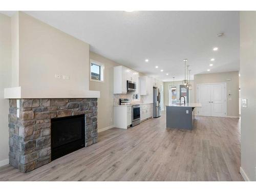 1224 18A Street Ne, Calgary, AB - Indoor Photo Showing Living Room With Fireplace