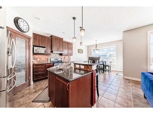 153 Chapalina Heights Se, Calgary, AB - Indoor Photo Showing Kitchen