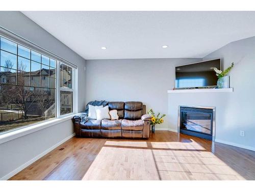 565 Panamount Boulevard Nw, Calgary, AB - Indoor Photo Showing Living Room With Fireplace