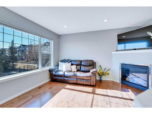 565 Panamount Boulevard Nw, Calgary, AB - Indoor Photo Showing Living Room With Fireplace