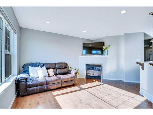 565 Panamount Boulevard Nw, Calgary, AB - Indoor Photo Showing Living Room With Fireplace