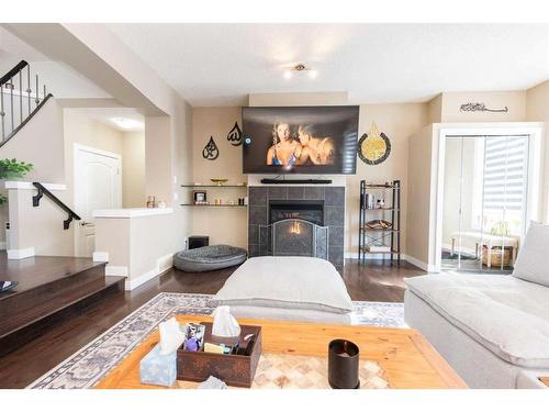 53 Auburn Bay Green Se, Calgary, AB - Indoor Photo Showing Living Room With Fireplace