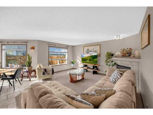 175 Panamount Street Nw, Calgary, AB - Indoor Photo Showing Living Room With Fireplace