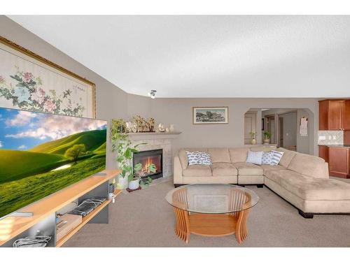 175 Panamount Street Nw, Calgary, AB - Indoor Photo Showing Living Room With Fireplace