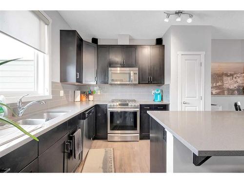 810 Walden Drive Se, Calgary, AB - Indoor Photo Showing Kitchen With Stainless Steel Kitchen With Double Sink With Upgraded Kitchen