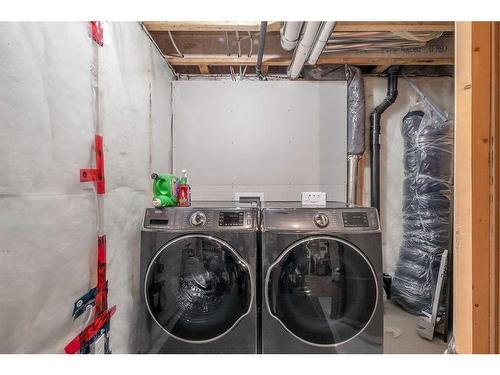 810 Walden Drive Se, Calgary, AB - Indoor Photo Showing Laundry Room