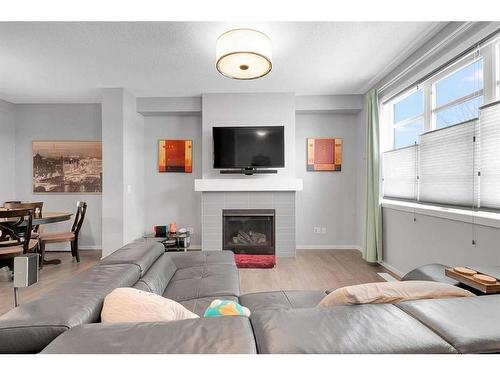 810 Walden Drive Se, Calgary, AB - Indoor Photo Showing Living Room With Fireplace