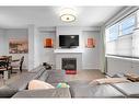 810 Walden Drive Se, Calgary, AB  - Indoor Photo Showing Living Room With Fireplace 