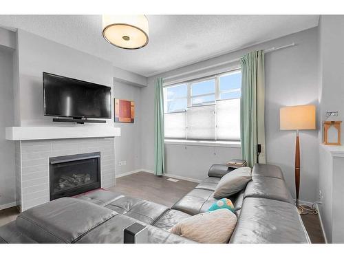 810 Walden Drive Se, Calgary, AB - Indoor Photo Showing Living Room With Fireplace