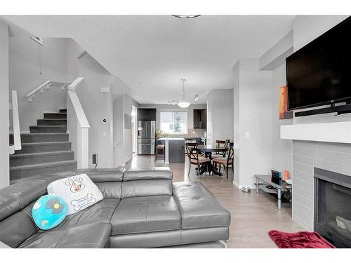 810 Walden Drive Se, Calgary, AB - Indoor Photo Showing Living Room With Fireplace