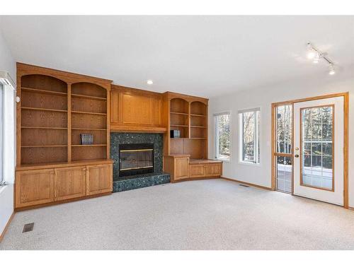 100 Anatapi Lane Sw, Calgary, AB - Indoor With Fireplace