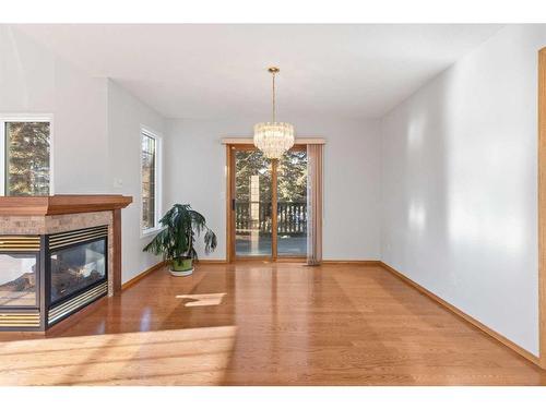 100 Anatapi Lane Sw, Calgary, AB - Indoor With Fireplace