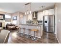 17 Legacy Common Se, Calgary, AB  - Indoor Photo Showing Kitchen With Stainless Steel Kitchen With Upgraded Kitchen 