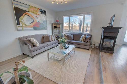 178 Autumn Circle Se, Calgary, AB - Indoor Photo Showing Living Room With Fireplace